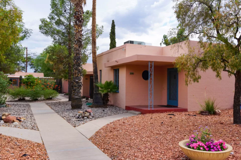 Red one-story Tucson home with gravel front yard